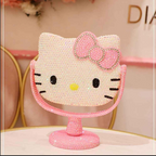Espejo estilo Hello Kitty decorado con pedrería y base rosada