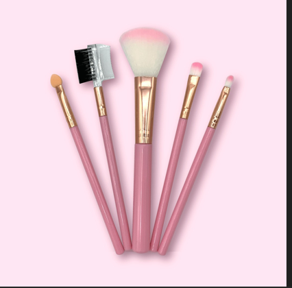 Set de cinco herramientas de maquillaje con mangos rosados y detalles dorados